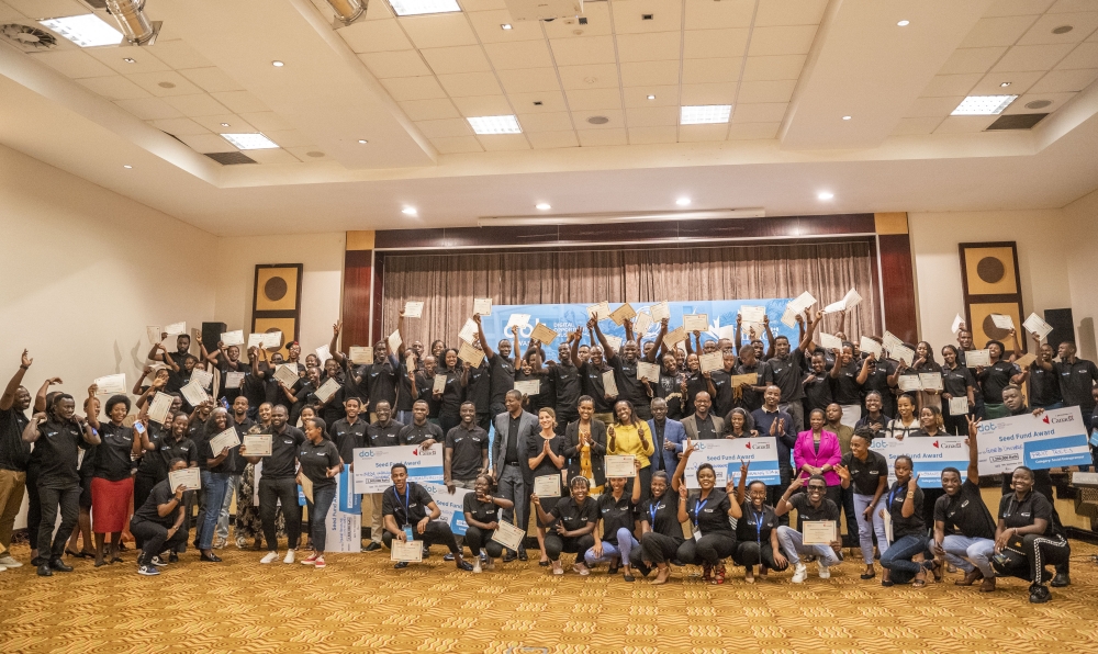 Officials and graduates pose for a group photo during the graduation ceremony in Kigali. Young graduates, equipped with Business and digital skills, became Digital Champions and Business Coaches, supporting MSMEs and social entrepreneurs