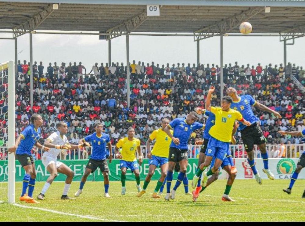 Rwanda skipper Kennedy Hoziana goes for an aerial ball in the third place game against Tanzania 