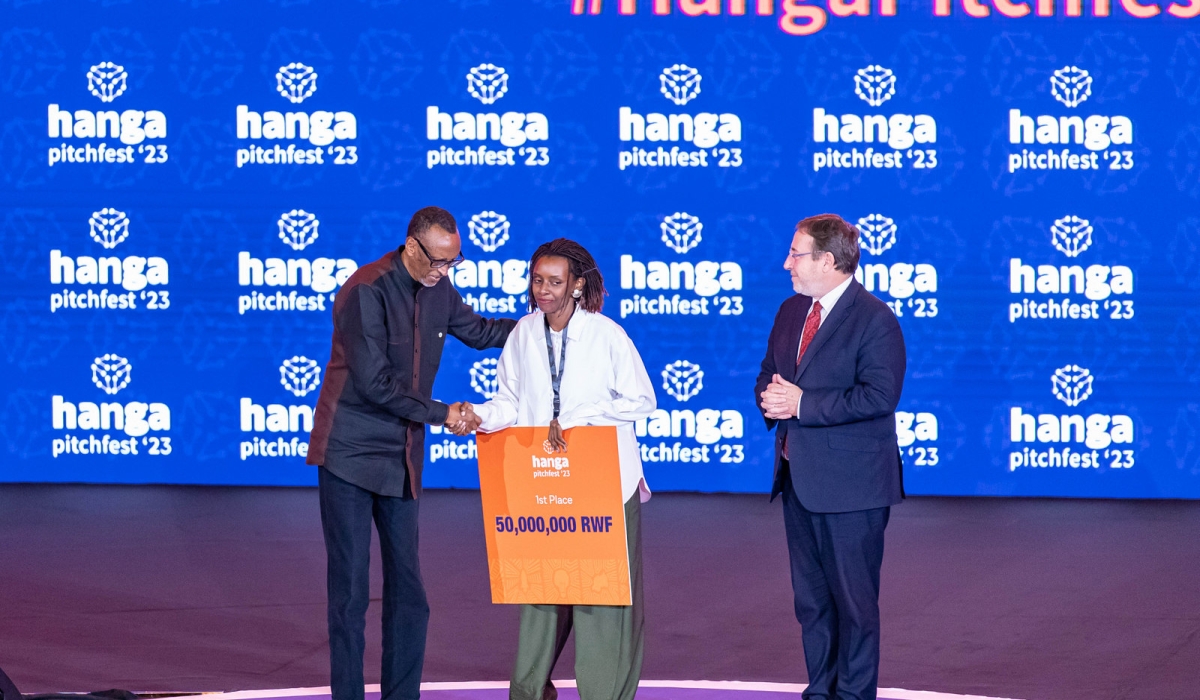 President Paul Kagame congratulating and awarding Cynthia Umutoniwabo, the Chief Executive and Founder of Loopa, the overall winner of Rwanda&#039;s largest startup competition, who took home a cash prize of Rwf50 million on Friday, December 8. All photos by Dan Gatsinzi
