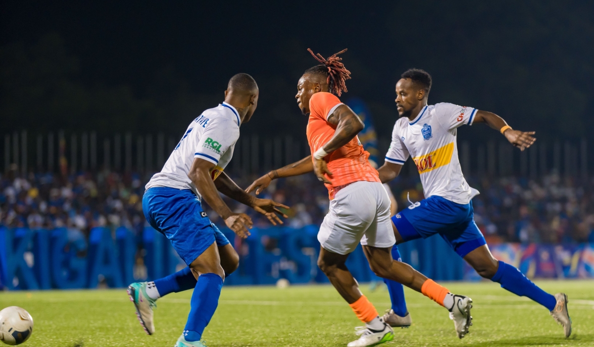 AS Kigali striker Kone Lottin Felix eliminates Rayon Sports defender Abdoul Rwatubyaye and midfielder Rashid Kalisa as Kigali City sponsored team  upset the Blues 2-1 on Saturday at Kigali Pele Stadium . Courtesy