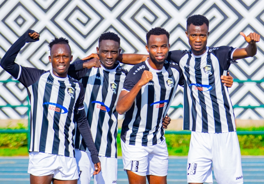 APR FC  striker Victor Mbaoma (R) with teammate during a celebration of a 3-1 victory over Amagaju FC at Huye Stadium on Monday, December 11. Photo by Julius Ntare