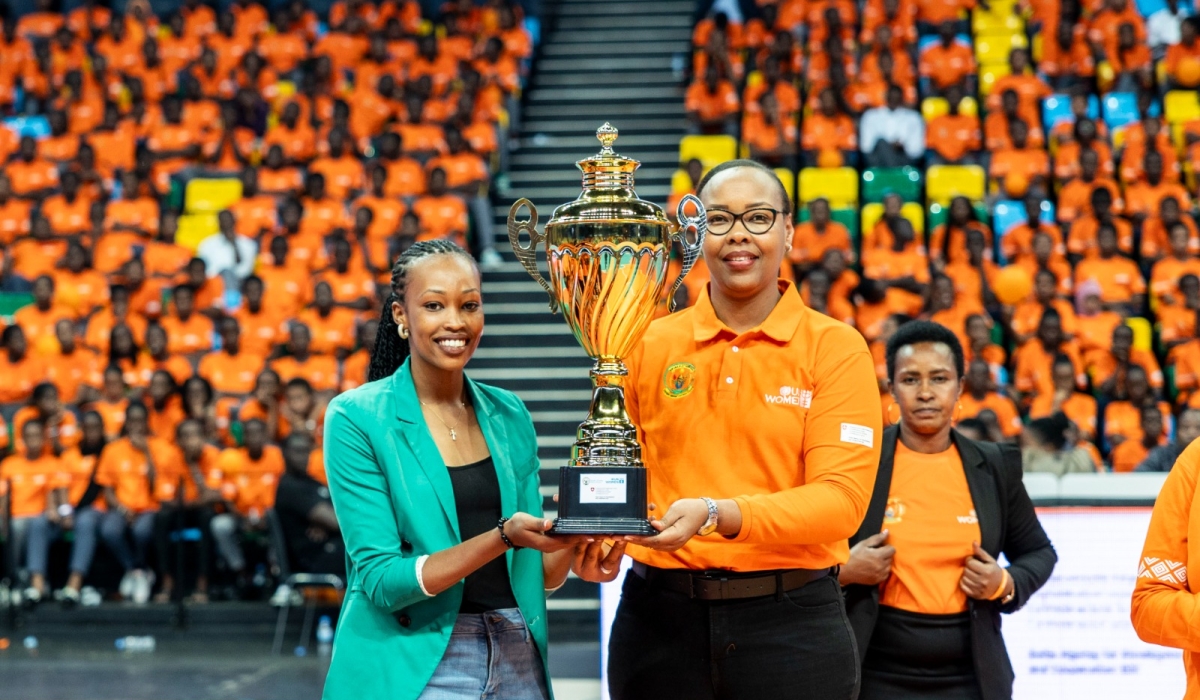 Minister Mimosa hand over the trophy to APR Volleyball captain during the closing ceremony of the 16 Days of Activism against Gender Based Violence event held at BK Arena on Sunday, December 10.