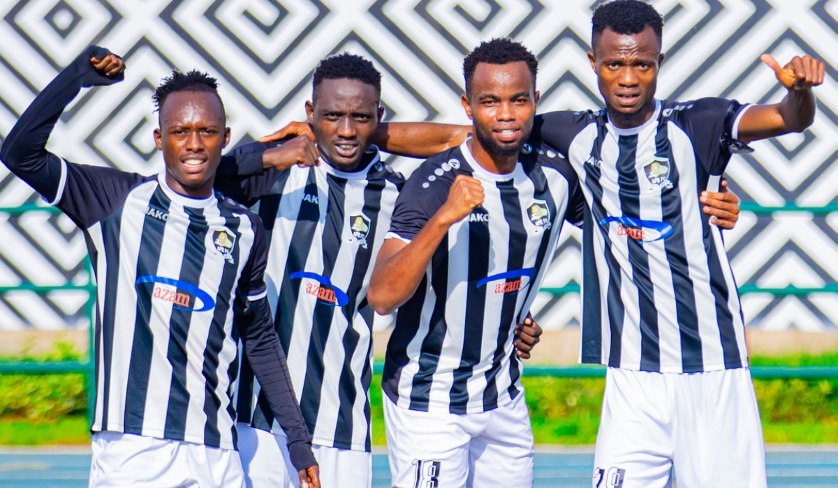 APR FC  striker Victor Mbaoma (R) with teammate during a celebration of a 3-1 victory over Amagaju FC at Huye Stadium on Monday, December 11. Photo by Julius Ntare