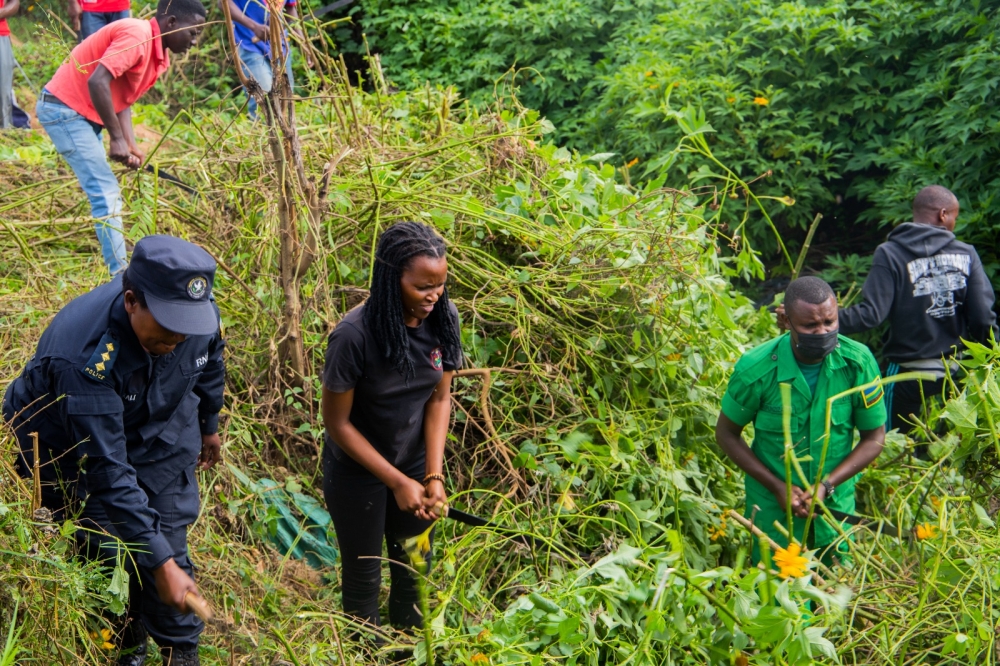 Police officers and other security agencies during a past community work (Umuganda) exercise. In Rwanda, security agencies regularly join hands with the citizenry in many community development activities. Courtesy