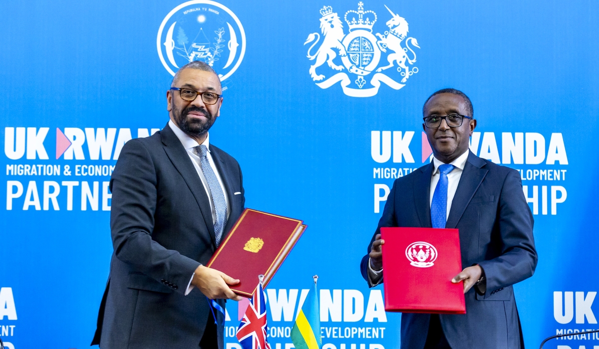 The Minister of Foreign Affairs and International Cooperation, Dr Vincent Biruta, and UK Home Secretary James Cleverly during the signing of a new migration treaty between the two countries in Kigali, December 5 