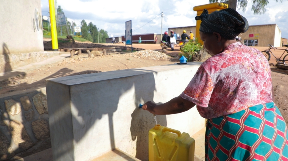 A resident fetches water at a newly completed water supply project that seeks to enable many residents have access to clean water in Nyanza. According to the Water and Sanitation Cooperation (WASAC), Rwanda will need at least $400 million (nearly Rwf500 billion) every year to meet water demand by 2050. Courtesy