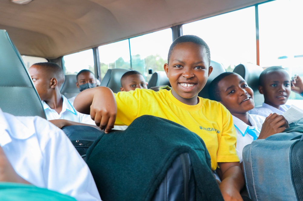 Students board a bus on their way to school on January 4. NESA released a comprehensive schedule for the return of boarding school students to their homes during the upcoming holiday break. PHOTO BY DAN GATSINZI