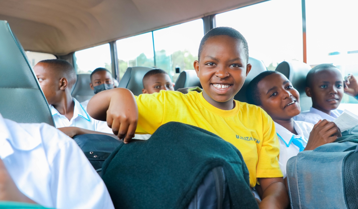 Students board a bus on their way to school on January 4. NESA released a comprehensive schedule for the return of boarding school students to their homes during the upcoming holiday break. PHOTO BY DAN GATSINZI
