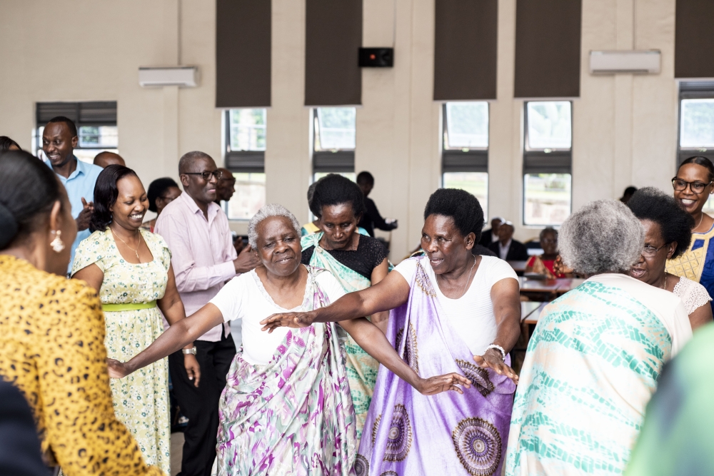 Some of Intwaza dance with members of the Unity Club during an event to celebrate festive season at Impinganzima Hostel in Bugesera District . Courtesy