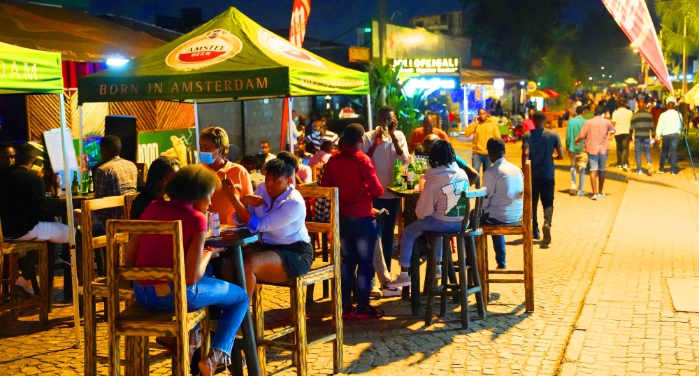 Clients share a drink at Kisimenti Car Free Zone.RDB is due to release new guidelines for nighttime entertainment activities for the festive season. Photo by Craish Bahizi