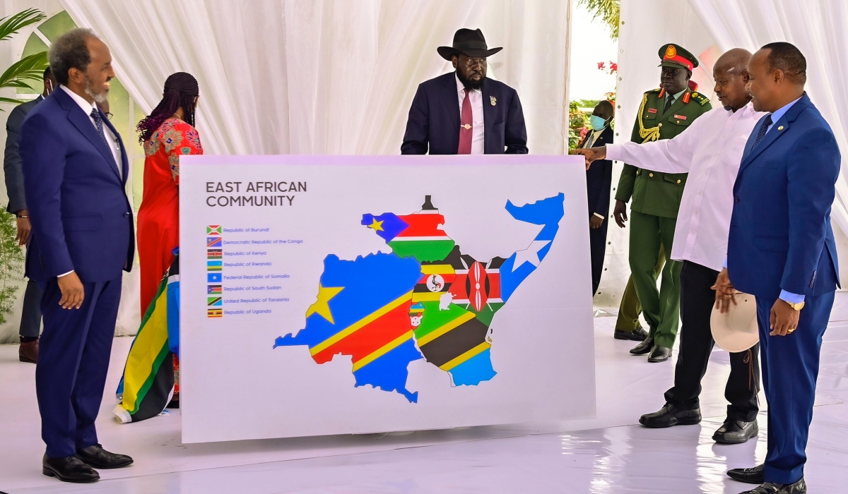 Somalia’s President Sheikh Hassan Mohamud (left), the Chairperson of the EAC Summit, President Salva Kiir of South Sudan (centre), Ugandan President Yoweri Kaguta Museveni, and EAC Secretary General Peter Mathuki, look at the new map of the regional bloc after Somalia inched closer to joining the seven-member Community by signing the Treaty of Accession with the EAC at State House, Entebbe, Uganda on Friday, December 15.