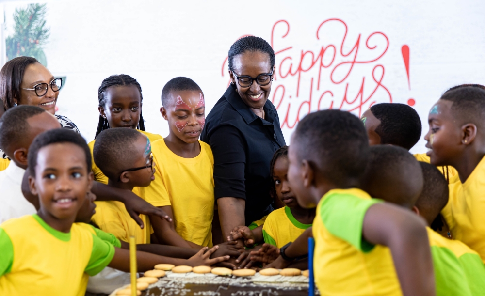First Lady, Jeannette Kagame cuts a cake with children during the annual End of Year Children’s Party at Village Urugwiro, on Saturday, December 16. PHOTOS BY DAN GATSINZI
