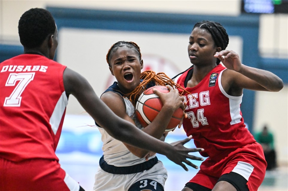 REG Women’s Basketball Club players vie for the ball with Cameroon’s Université de Douala player as the Rwandan side stun them 85-54  on Sunday, December 17. Courtesy