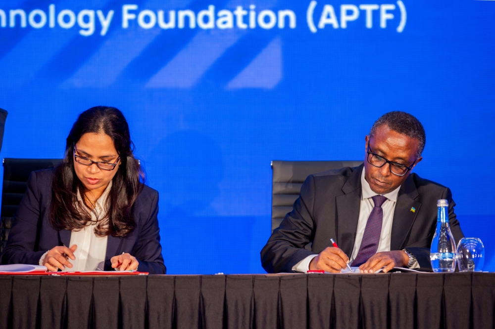 Dr Vincent Biruta, Minister of Foreign Affairs and Prof. P.G. Sampath of the Africa Pharmaceutical Technology Foundation (APTF), sign the Host Country Agreement between Rwanda and APTF in Kigali on Monday, December 18. Courtesy