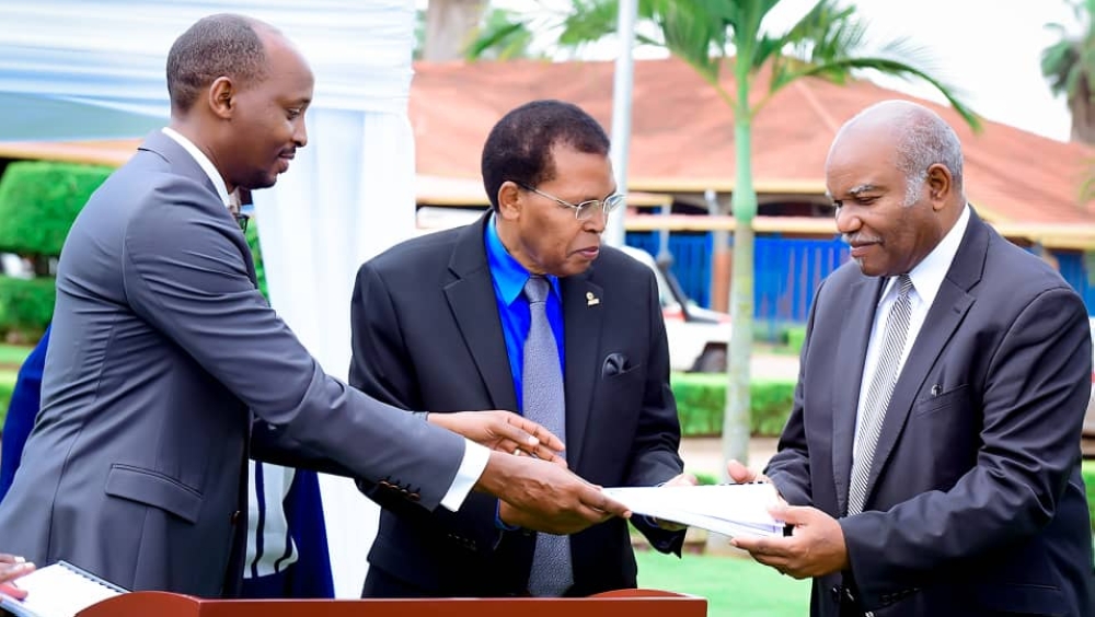 Minister of Health Dr Sabin Nsanzimana, Hesron Byiringiro the president of the Seventh-day Adventist Church and Dr Zeno L. Charles-Marcel, the Assoc. Director of Adventist Health Ministry at the Headquarters of the SDA World Church during the handover on Friday, December 15. Courtesy.