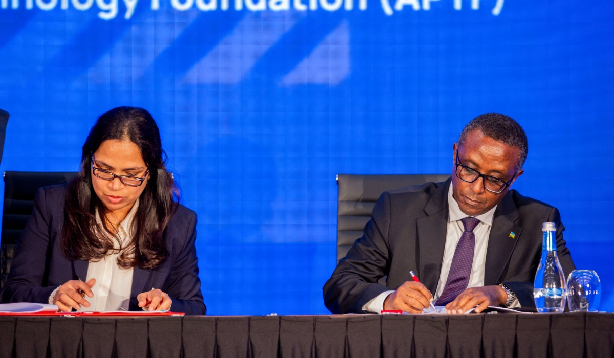 Dr Vincent Biruta, Minister of Foreign Affairs and Prof. P.G. Sampath of the Africa Pharmaceutical Technology Foundation (APTF), sign the Host Country Agreement between Rwanda and APTF in Kigali on Monday, December 18. Courtesy