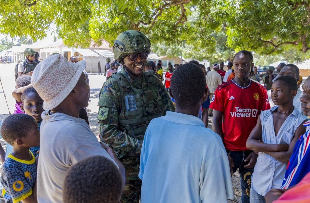 The Deputy Spokesperson of the Rwanda Defence Force, Lt Col SimoN Kabera interacts with residents of Quionga, Palma District on December 18, 2023. All photos by Christianne Murengerantwari