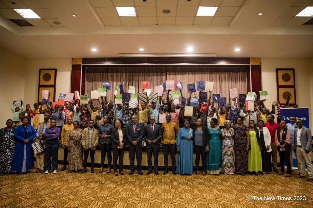 Officials pose for a photo with Children as I&M Bank,  Kigali Serena Hotel, hosted a Christmas party for the children of SOS Village des Enfants located in Byumba, Gicumbi District. Photos by Emmauel Dushimimana