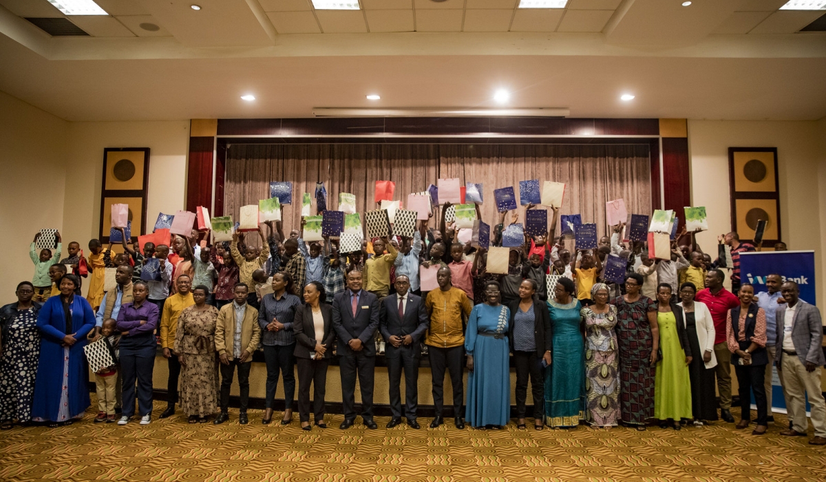 Officials pose for a photo with Children as I&M Bank,  Kigali Serena Hotel, hosted a Christmas party for the children of SOS Village des Enfants located in Byumba, Gicumbi District. Photos by Emmauel Dushimimana
