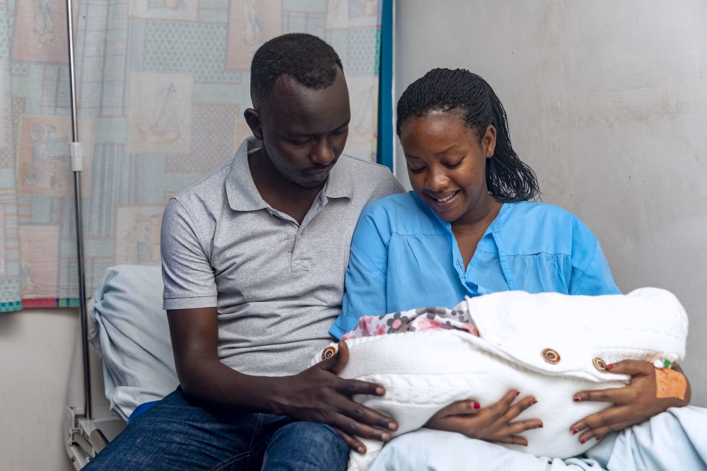 Winnie Mutesi and her husband Muhumuza with their baby "Ivah Iriza Muhumuza" born on Christmas at Hopital La Croix du Sud in Kigali, on Monday, December 25. According to statistics at least 40 babies were born on Christmas day, in four major hospitals in Kigali, by midday. Photo by Christianne Murengerantwari