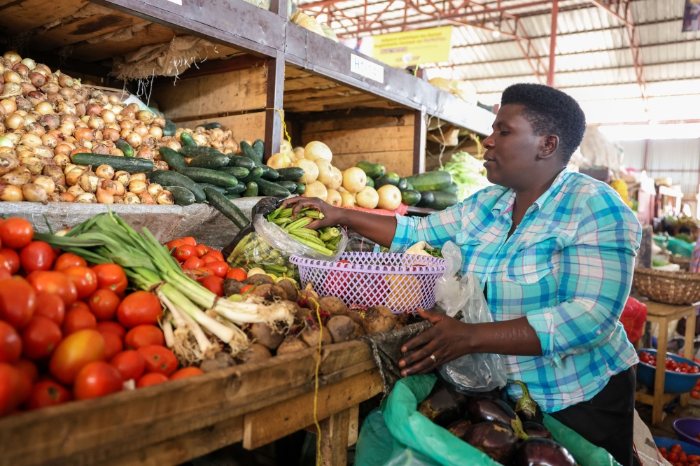 Christine Uwamahoro, a market trader in Muhanga  said that before the support, it was a challenge to get a loan from banks but now she trades agricultural produce including onions, tomatoes, and peas. All photos were taken by Willy Mucyo