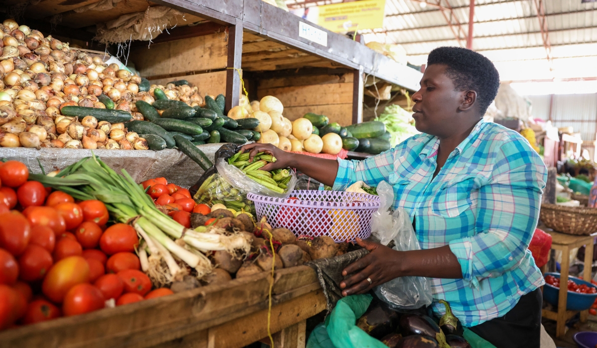 Christine Uwamahoro, a market trader in Muhanga  said that before the support, it was a challenge to get a loan from banks but now she trades agricultural produce including onions, tomatoes, and peas. All photos were taken by Willy Mucyo