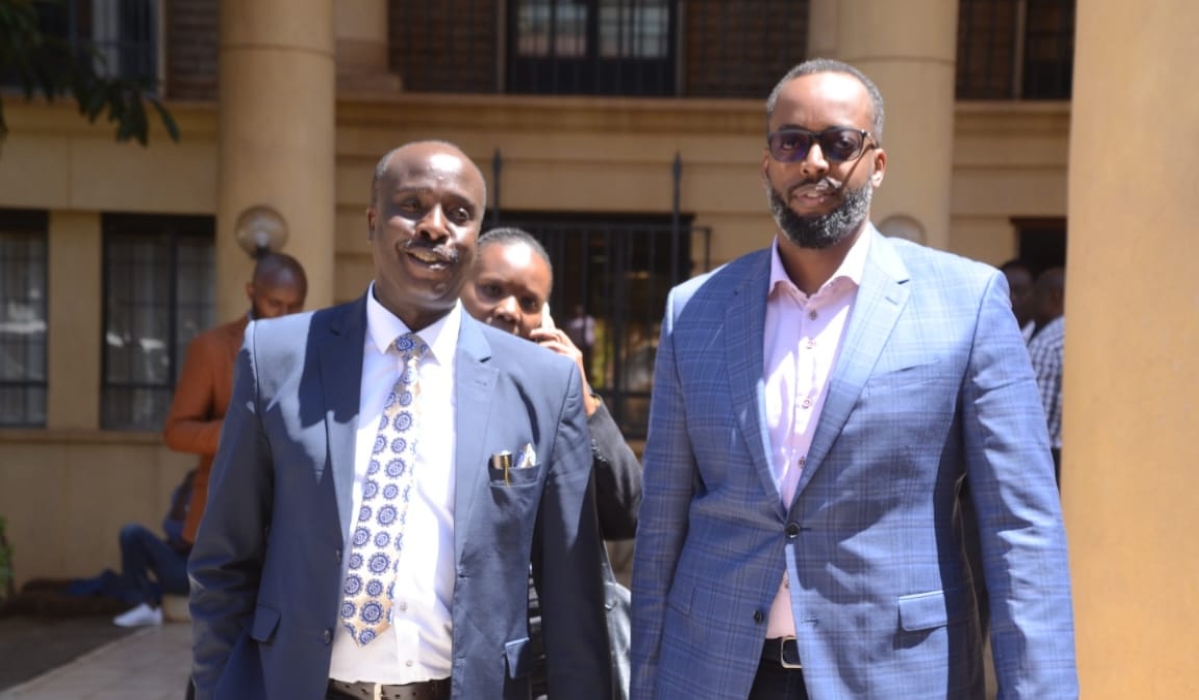 Desire Muhinyuza (L) with his lawyer at the court in Kenya