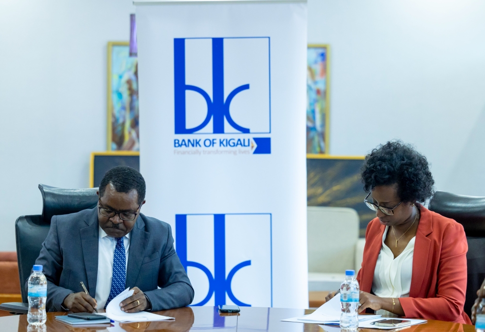 Vincent Munyeshyaka, the BDF chief executive and Diane Karusisi, the BK Chief Executive signed a partial credit fund agreement to lend to more clients   on Wednesday, December 27. Courtesy