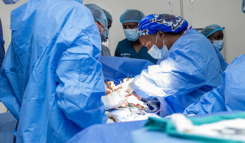 Rwandan surgeons together with American surgeons carry out a transplant surgery on a patient at King Faisal Hospital (KFH) (courtesy).