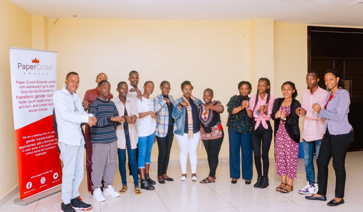 Paper Crown Rwanda staff pose for a photo with its youth advisory council. Courtesy photos