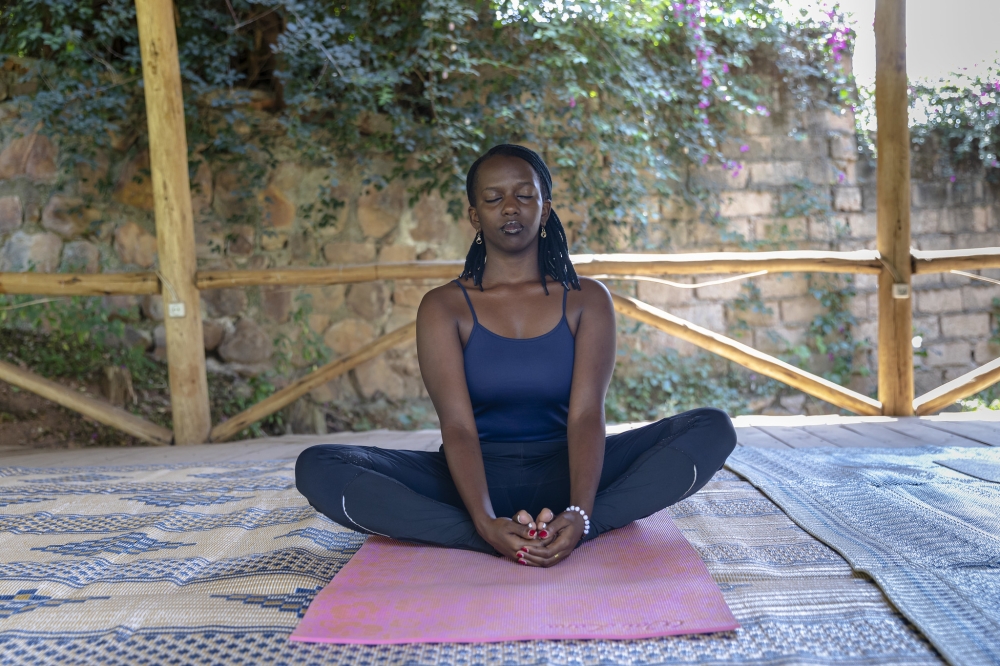 Jade Iriza Natasha during a yoga practice session in Kigali. The seamless interaction between mental and physical well-being plays a vital role in nurturing a balanced and satisfying life. Photo by Christianne Murengerantwari.