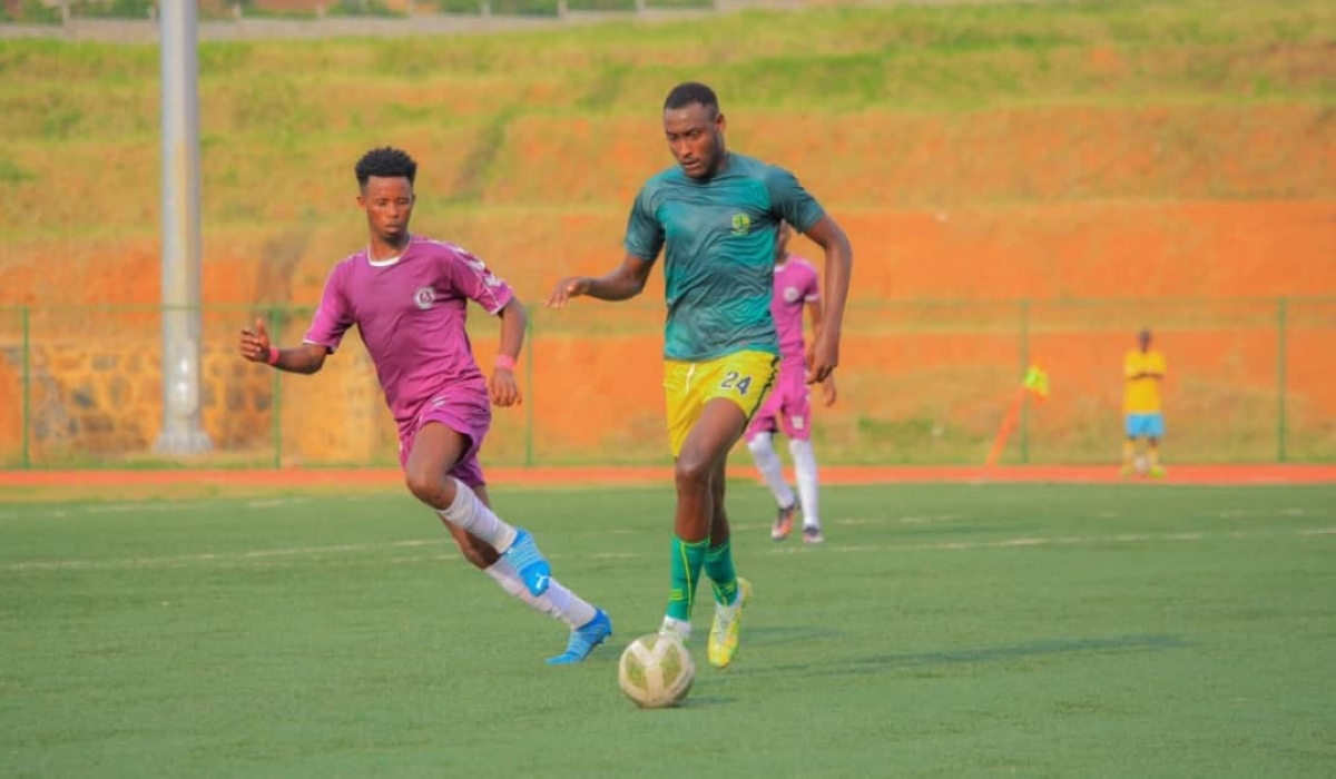 Marine FC striker Arthur Gitego with the ball against Sunrise FC player during a past game. Gitego has had an offer from AFC Leopards of Kenya. Courtesy