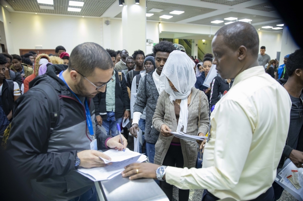 A group of refugees and asylum seekers evacuated from Libya on their arrival at Kigali International Airport in 2023. File