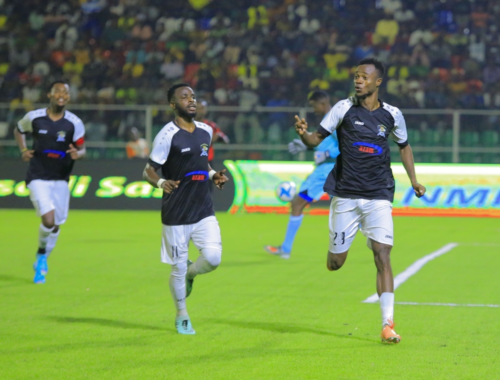 Striker Victor Mbaoma leads his teammates in celebration during a 3-1 quarter final clash in Zanzibar