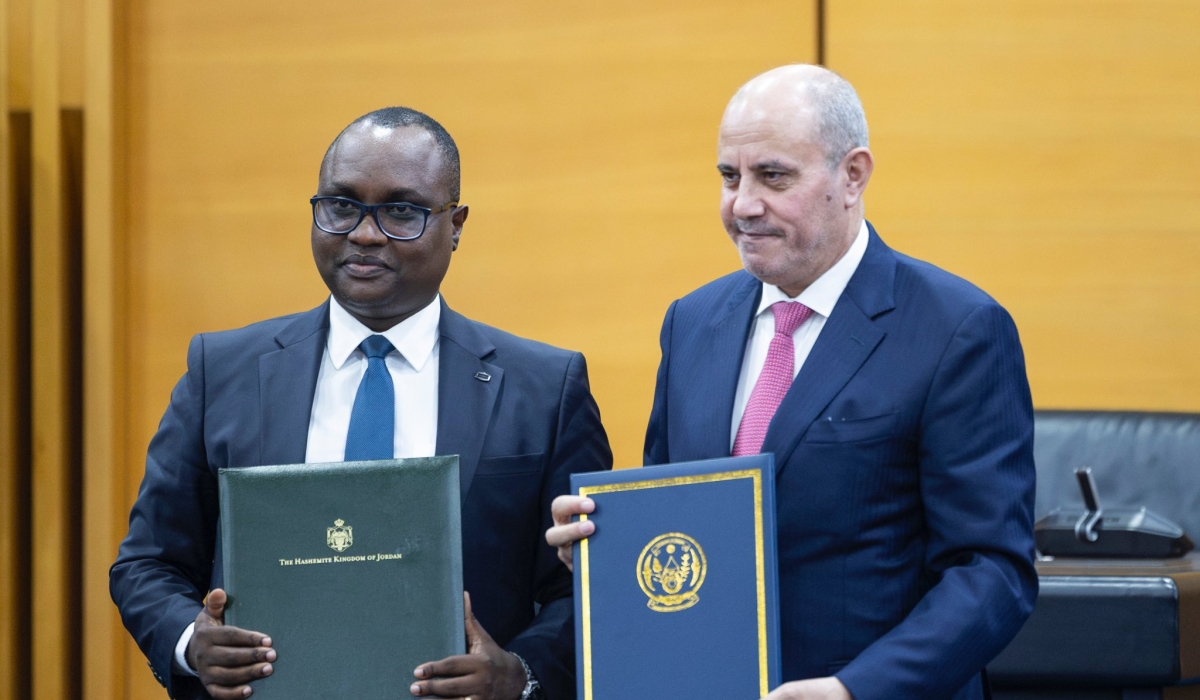 The Minister of Trade and Industry, Jean-Chrysostome Ngabitsinze, and his Jordanian counterpart Yousef Mahmoud Al Shamali, during the signing of various bilateral cooperation agreements in Kigali, on Sunday, January 7. Photo: Courtesy.