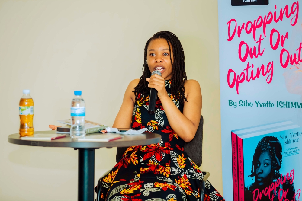 Sibo Yvette Ishimwe talking about her autobiography "Dropping Out or Opting Out?" during the launch and signing event on January 6 at Highlands Suites Hotel, Nyarutarama. COURTESY PHOTOS