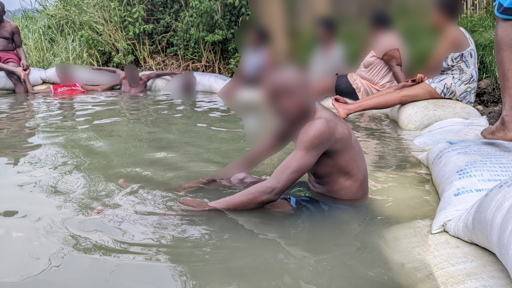 Some residents who turned up to swim at Nyamyumba hot springs  Photo by Germain Nsanzimana
