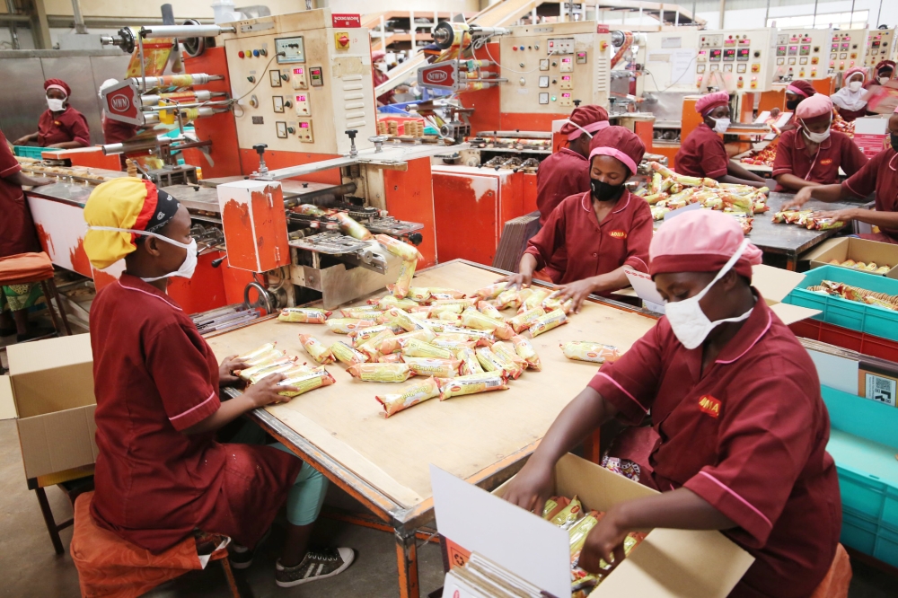 Workers packing biscuits inside a factory at Kigali Special Economic Zone (KSEZ) in May 2021. Rwanda’s economy is projected to grow by 7 per cent in 2024, up from 6.3 per cent in 2023. Photo by Craish Bahizi 