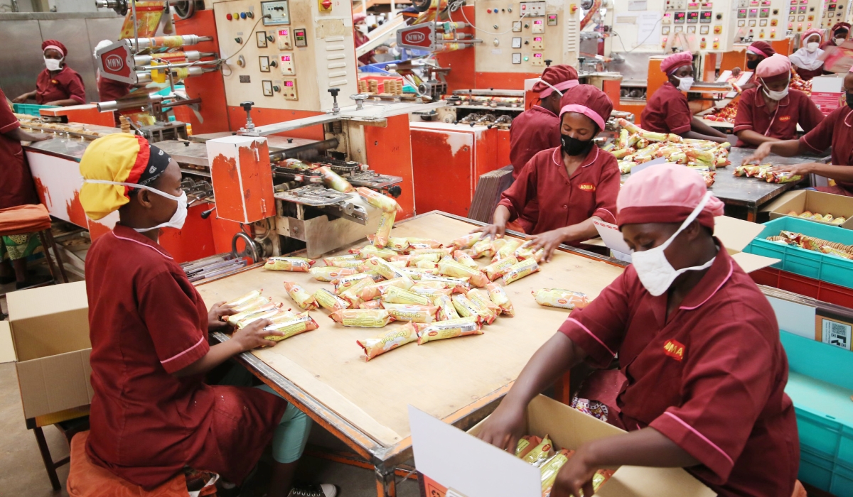 Workers packing biscuits inside a factory at Kigali Special Economic Zone (KSEZ) in May 2021. Rwanda’s economy is projected to grow by 7 per cent in 2024, up from 6.3 per cent in 2023. Photo by Craish Bahizi 