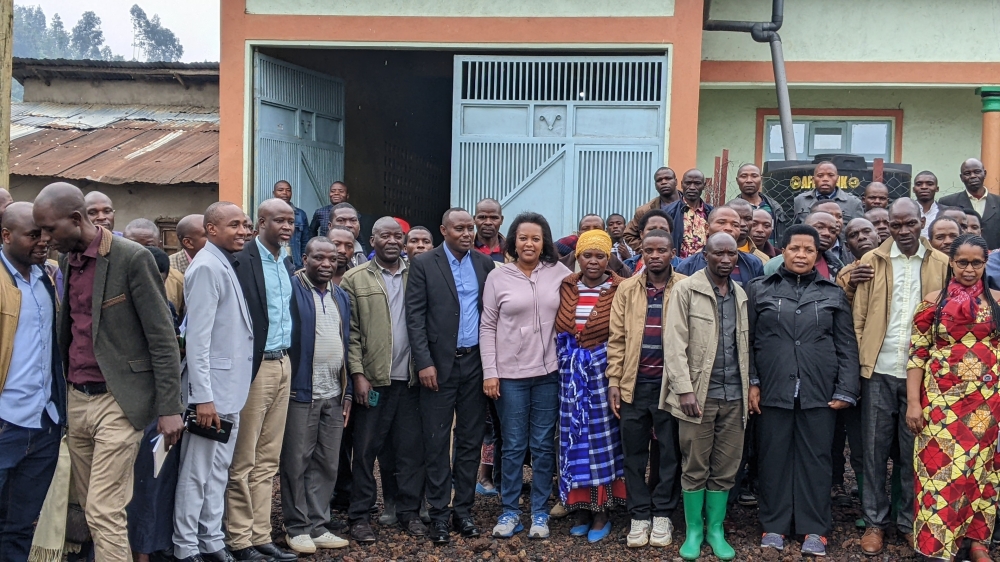 Kozamuika cooperative&#039;s members from Kanama sector pose for a group photo with senators and local authorities.