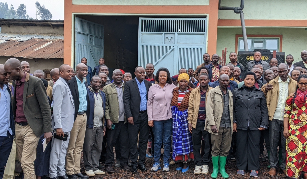 Kozamuika cooperative&#039;s members from Kanama sector pose for a group photo with senators and local authorities.