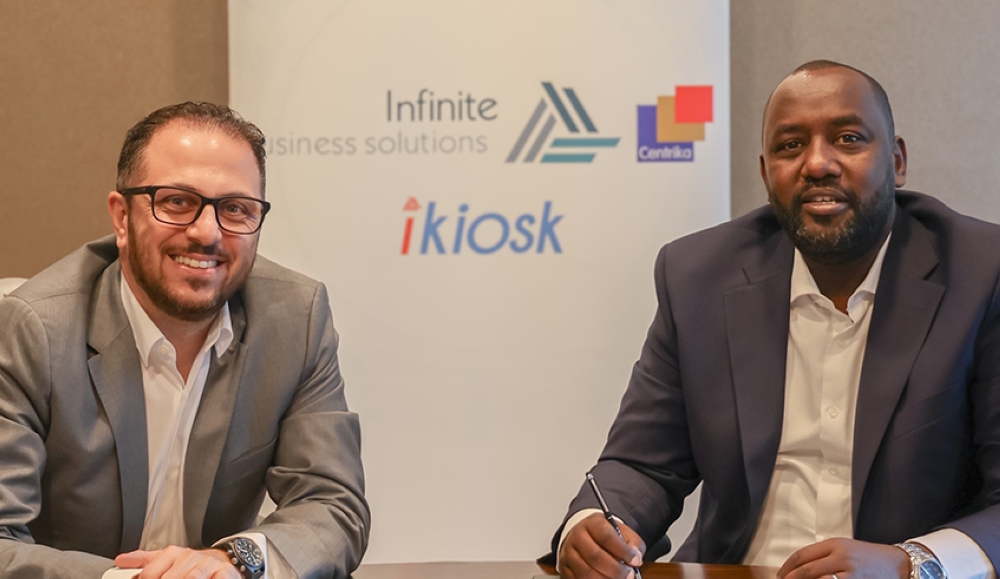 Mohammad Al-Azzeh, the Managing Partner at IBSand Willy Claude Karasira, Co-founder and Executive Director of Centrika during the
signing of the agreement in Kigali.