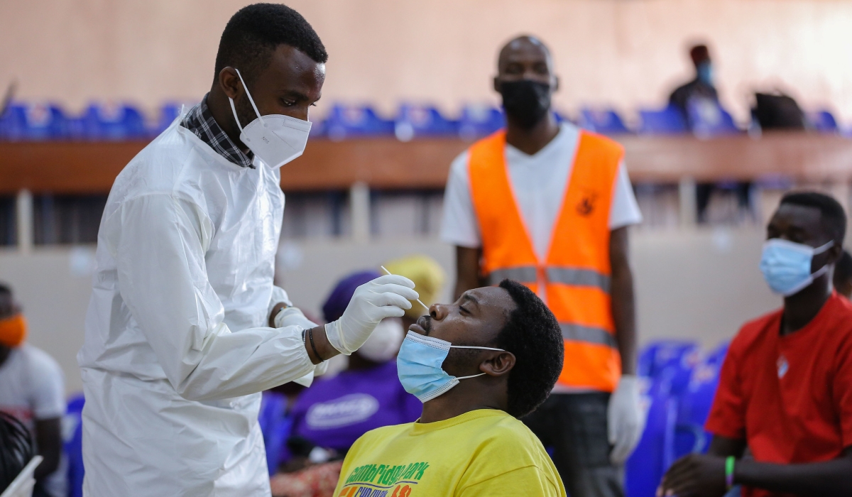 A health worker during mass test exercise of Covid 19  in Kigali on July 23, 2021. RBC clarifies upsurge of flu-like syndrome not linked to Covid-19