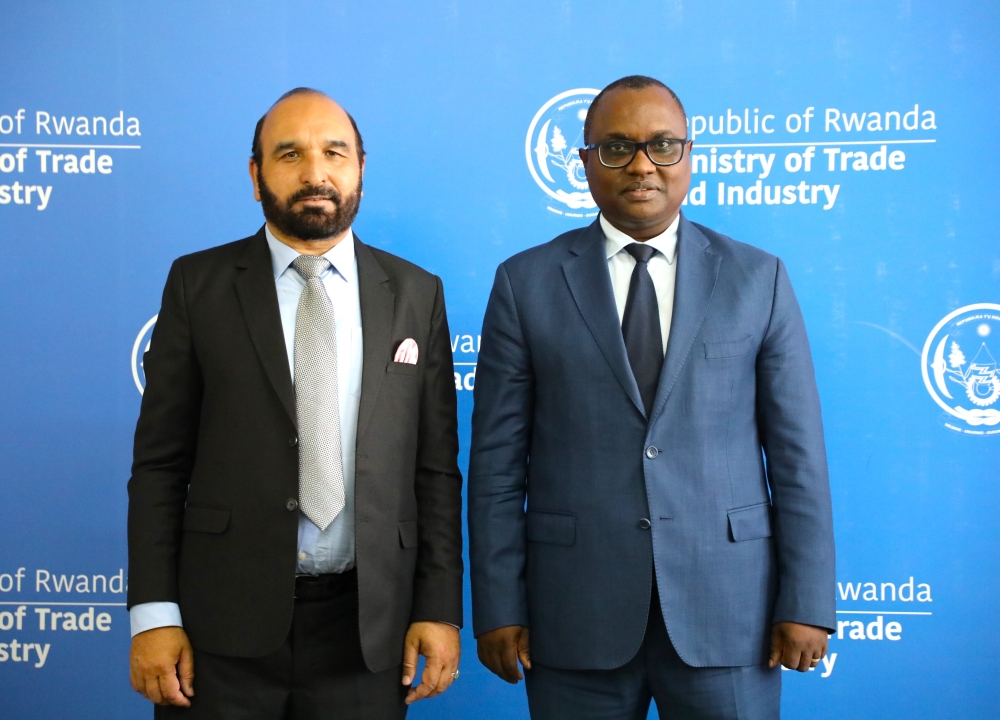 Minister of Trade and industry Jean-Chrysostome Ngabitsinze and the High Commissioner of Pakistan to Rwanda, Naeem Ullah KHAN pose for a photo. File