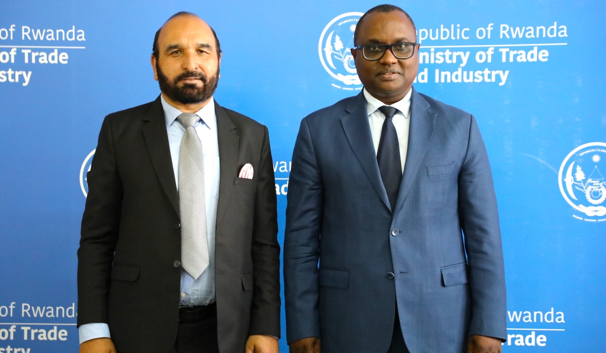 Minister of Trade and industry Jean-Chrysostome Ngabitsinze and the High Commissioner of Pakistan to Rwanda, Naeem Ullah KHAN pose for a photo. File