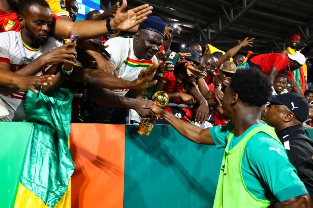 Guinea supporters celebrate Syli Natyional&#039;s win over The Gambia on Friday, January 19. Sxi supporters die amid celebrations-K. Tribouillard by AFP