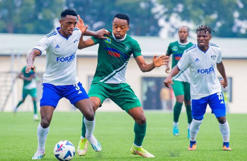 Gorilla FC and SC Kiyovu players vie for the ball during the second leg game. Gorilla secured a quarter-final berth in Peace Cup  despite losing 3-1 to Kiyovu at Kigali Pelé Stadium on Tuesday, January 23. Julius Ntare