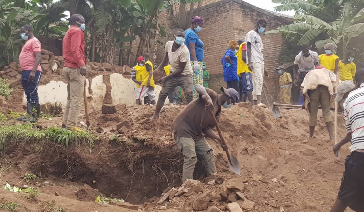 Residents searching for bodies of the victims of the Genocide against the Tutsi in Huye. Courtesy