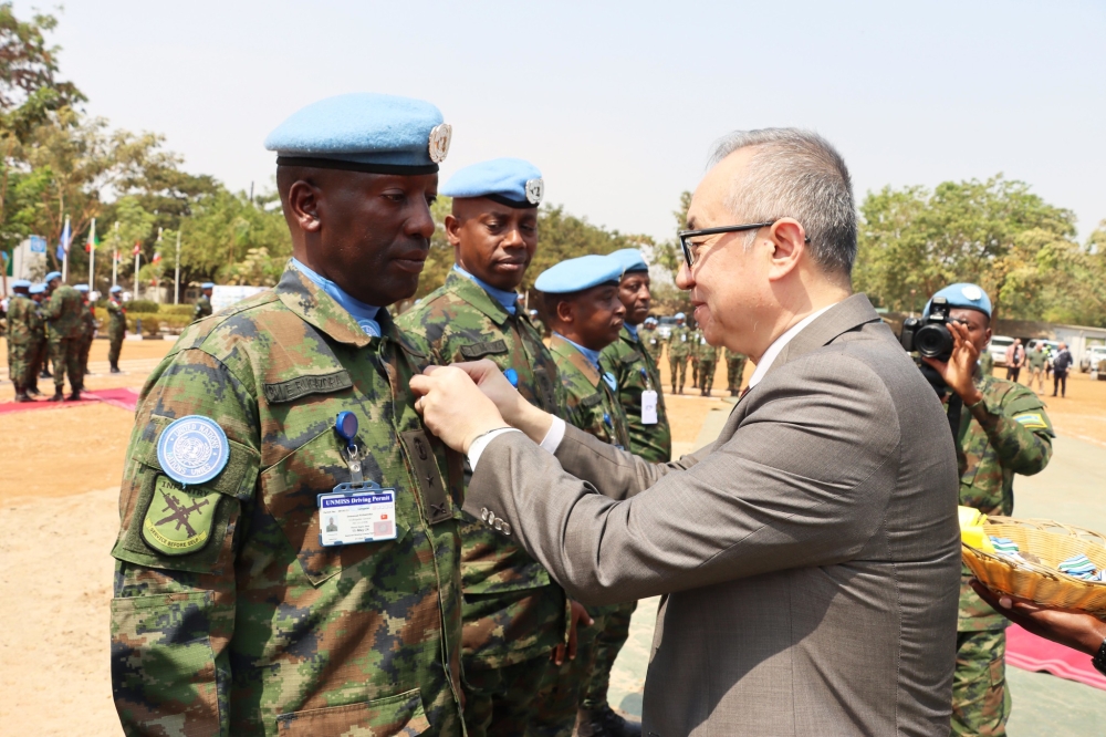 Deputy Special Representative of the UN Secretary General Guang Chong decorates Rwandan peacekeepers serving under the United Nations Mission in South Sudan (UNMISS), with UN service medals in recognition for their service  on Friday, January 26. Courtesy