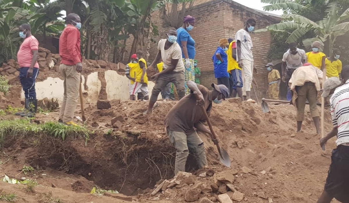 Residents searching for bodies of the victims of the Genocide against the Tutsi in Huye. So far, seven people have been arrested for concealing information about the remains of the victims. Courtesy